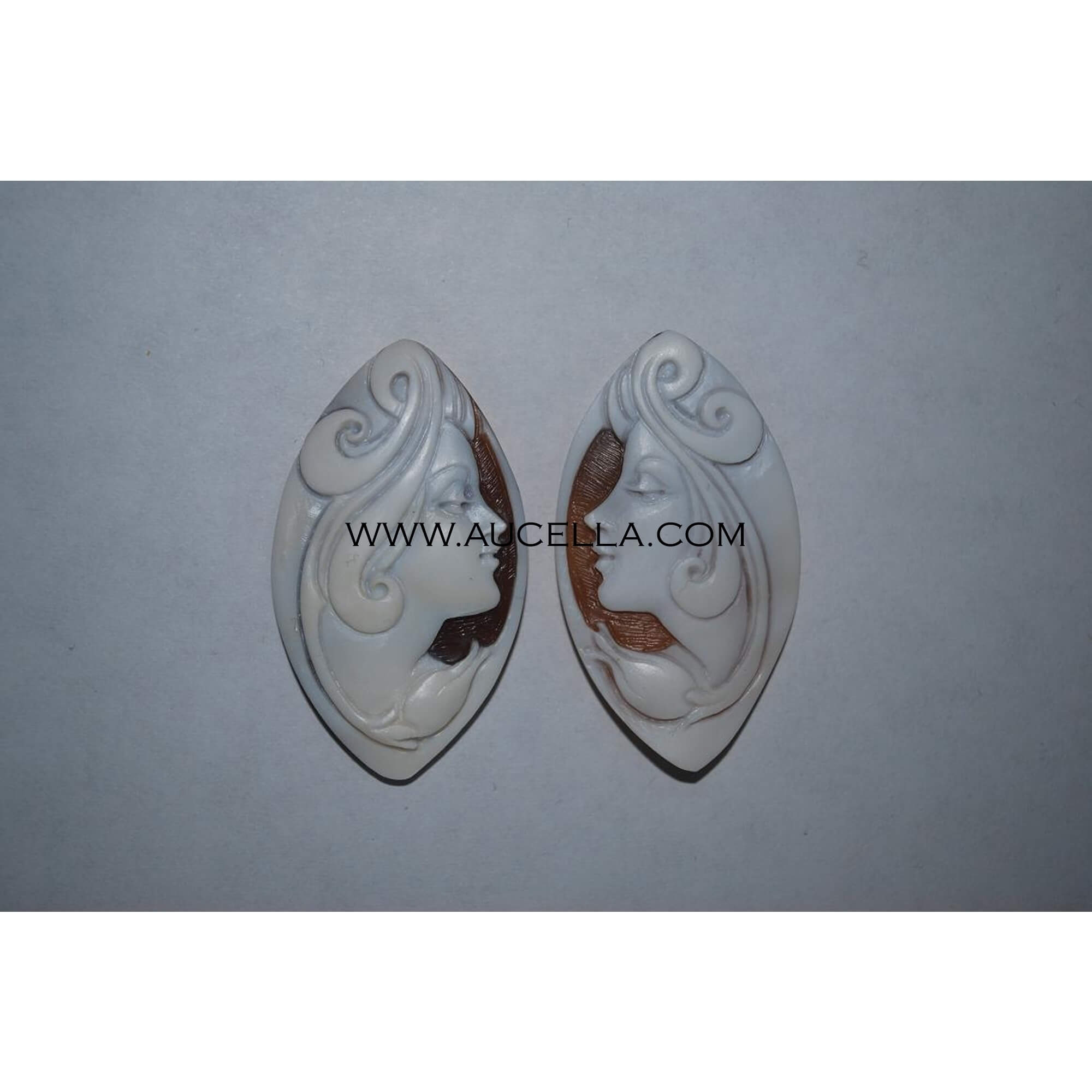 Woman carved on natural seashell cameo